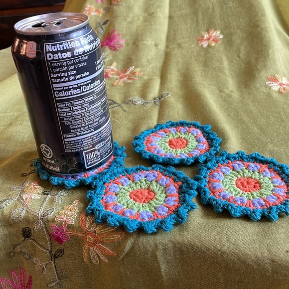 Hand crocheted Mandala coasters in dark teal, orange, violet and green - Picture 4 of 5